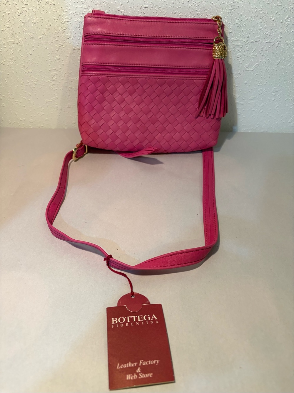 Pink Woven Leather Crossbody with Tassel Accent